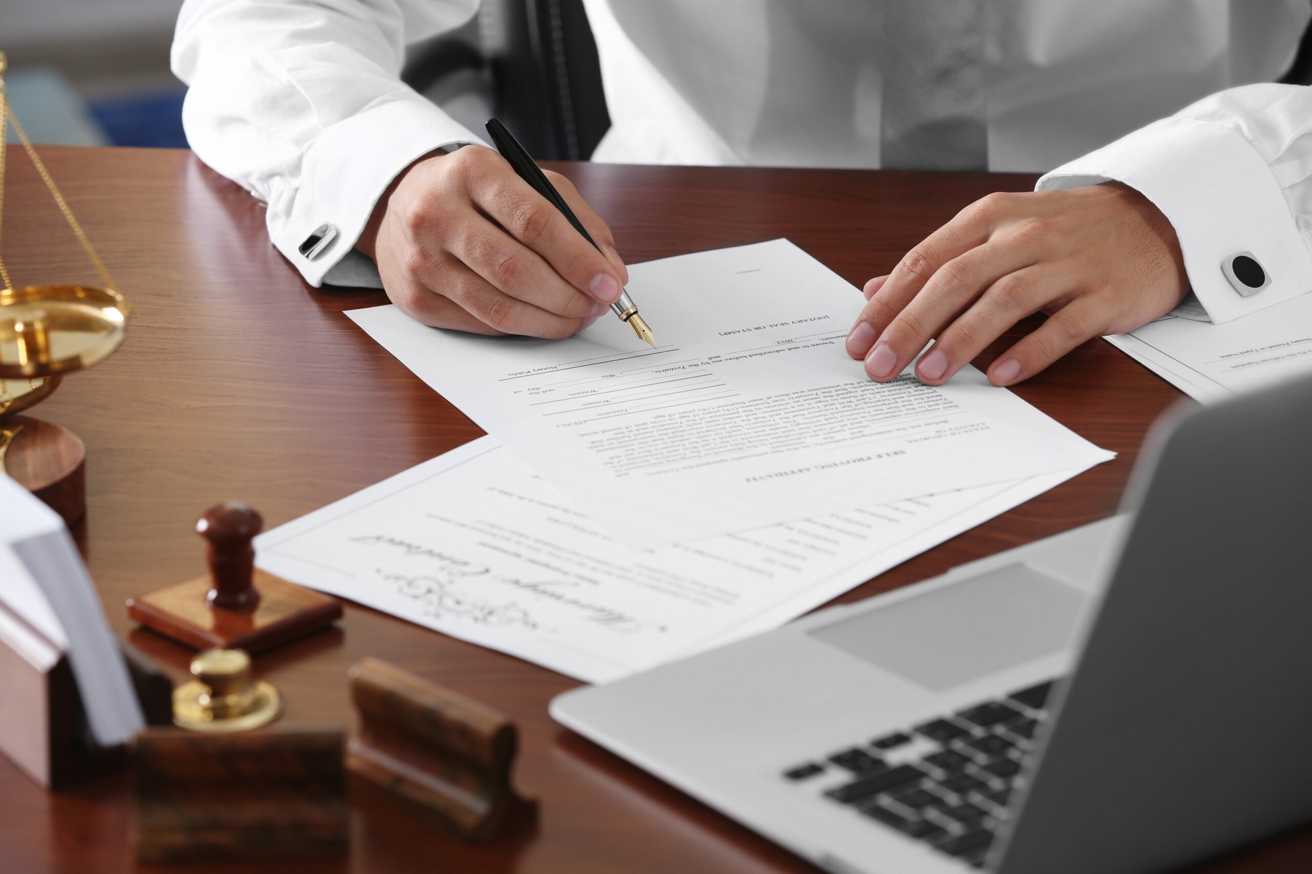 Notary public in office signing document