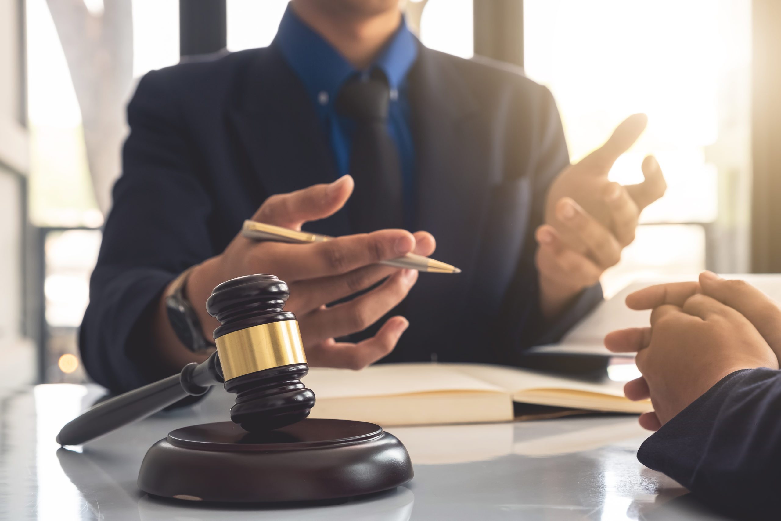 Business lawyer working about legal legislation in courtroom to