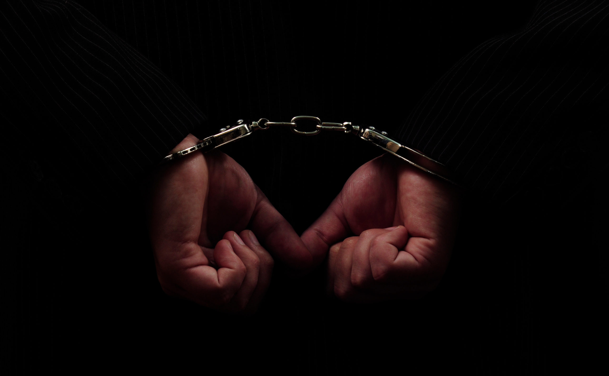 Hands in handcuffs