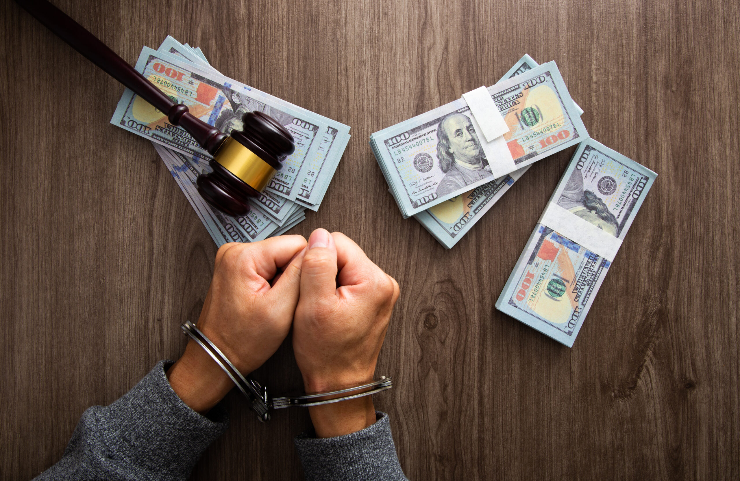 Concept for corruption, fraud and money laundry. Handcuff